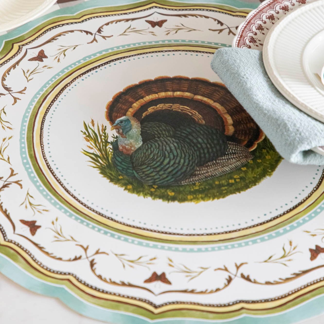 Die-cut Heritage Turkey China Placemat with a dinner plate and napkin.