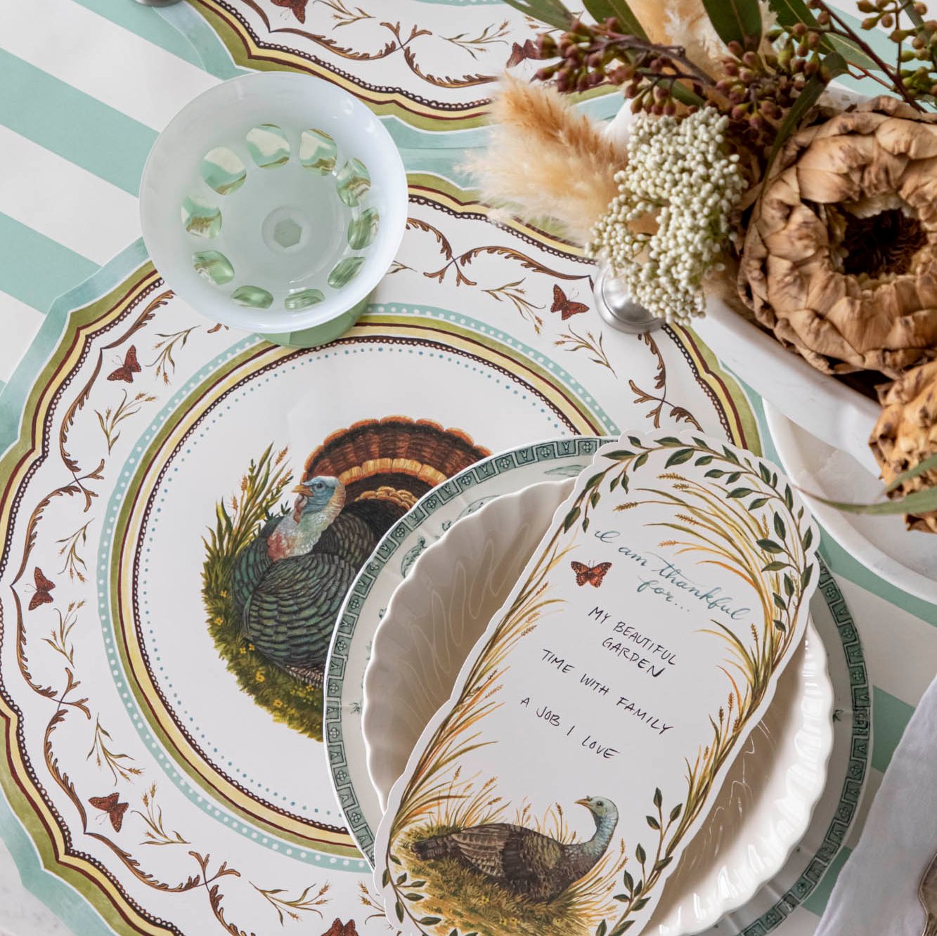 Die-cut Heritage Turkey China Placemat elegant tablescape with flowers and dinnerware.