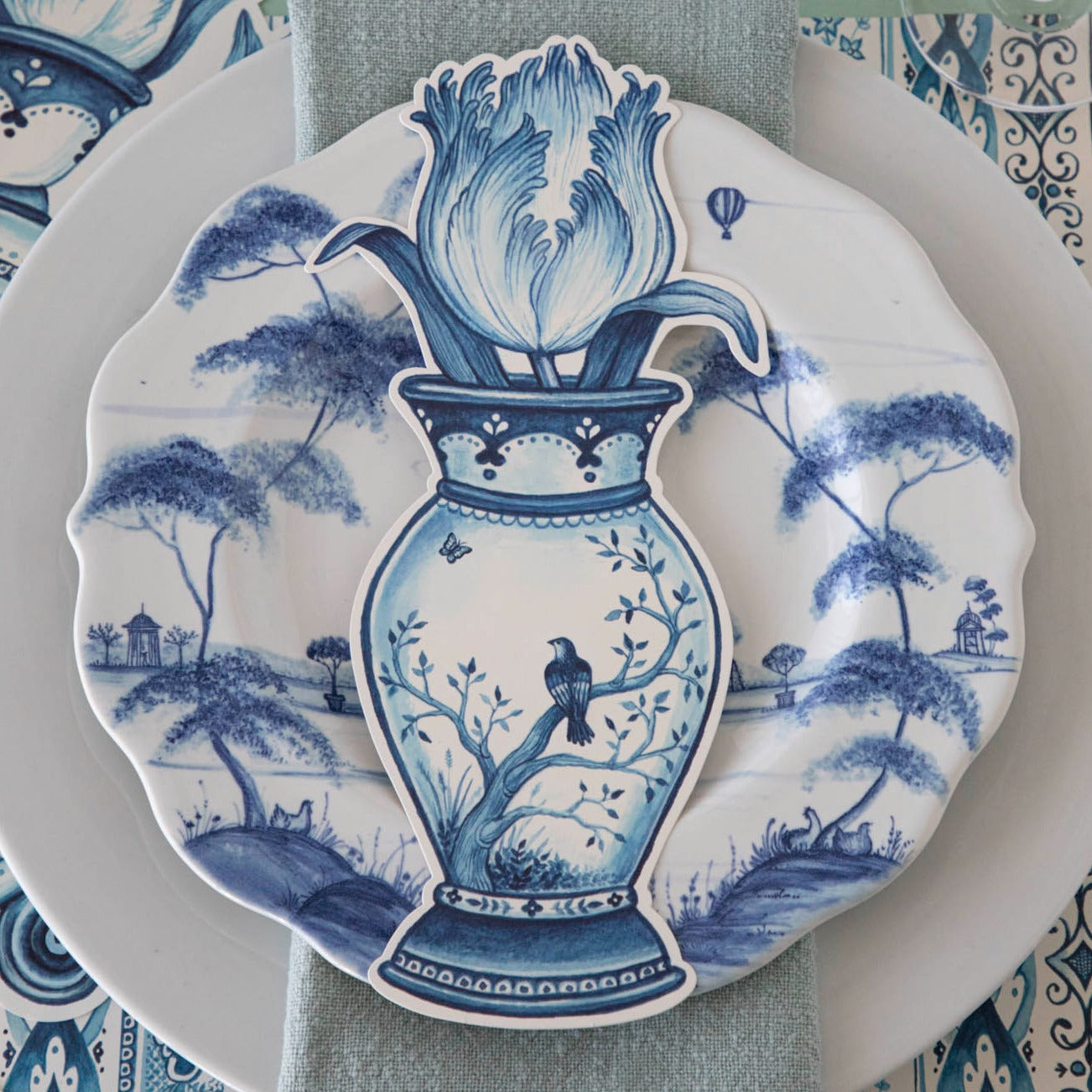 A versatile Indigo Tulip Table Accent by Hester & Cook, this blue and white plate with a bird on it adds a decorative touch to any space.