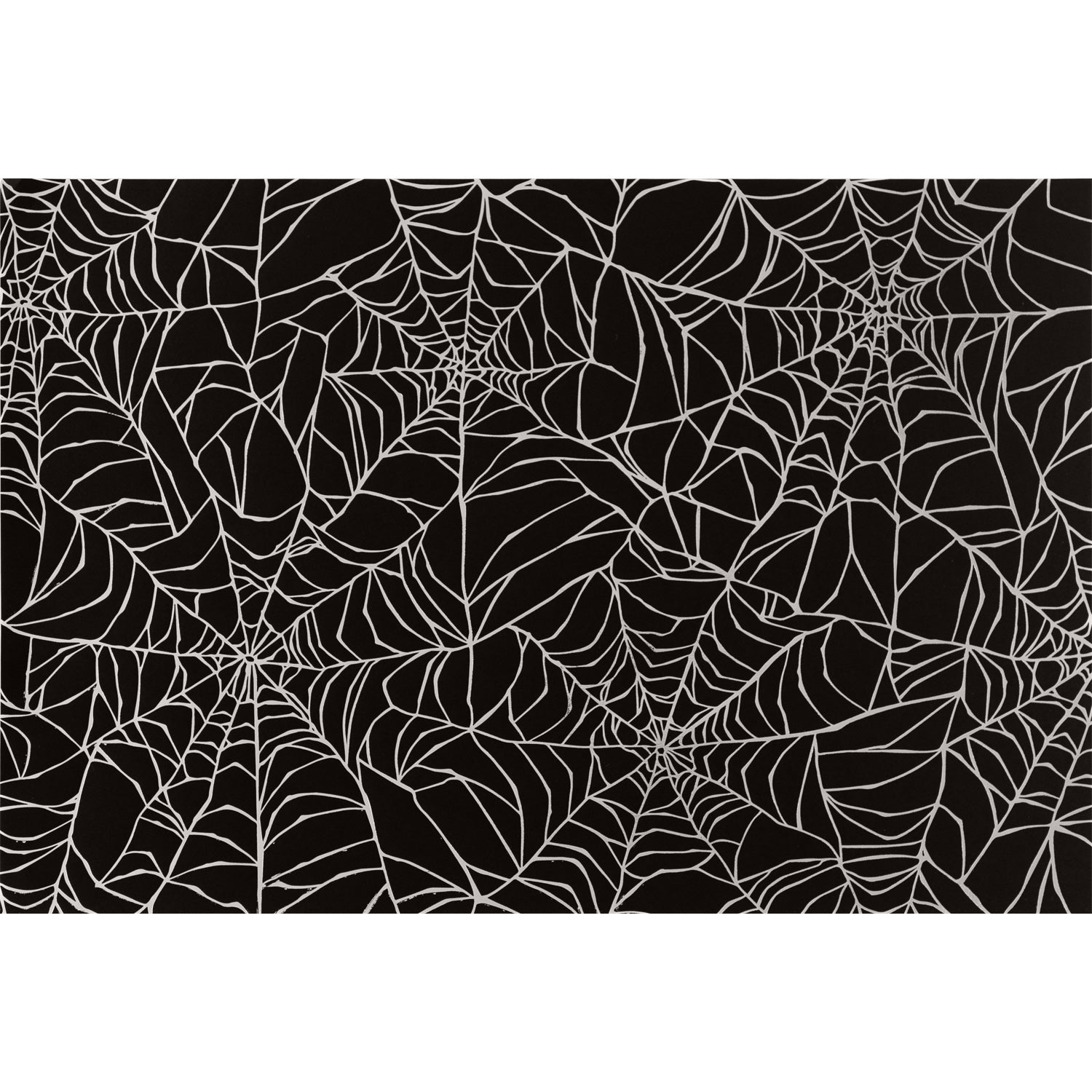 Spiderweb Placemat by Hester & Cook featuring an overlapping spiderweb pattern in silver with a black background.