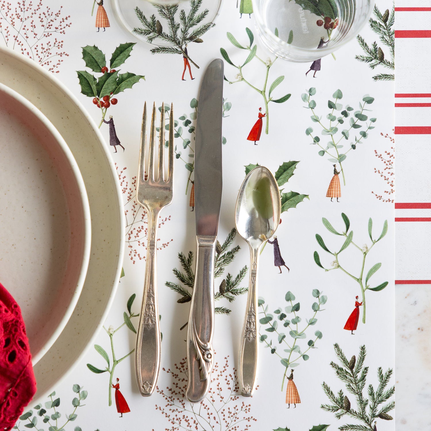 The Happy Christmas Placemat under vintage silverware and dinner plates, with the Antique Red Stripe Runner undereath.