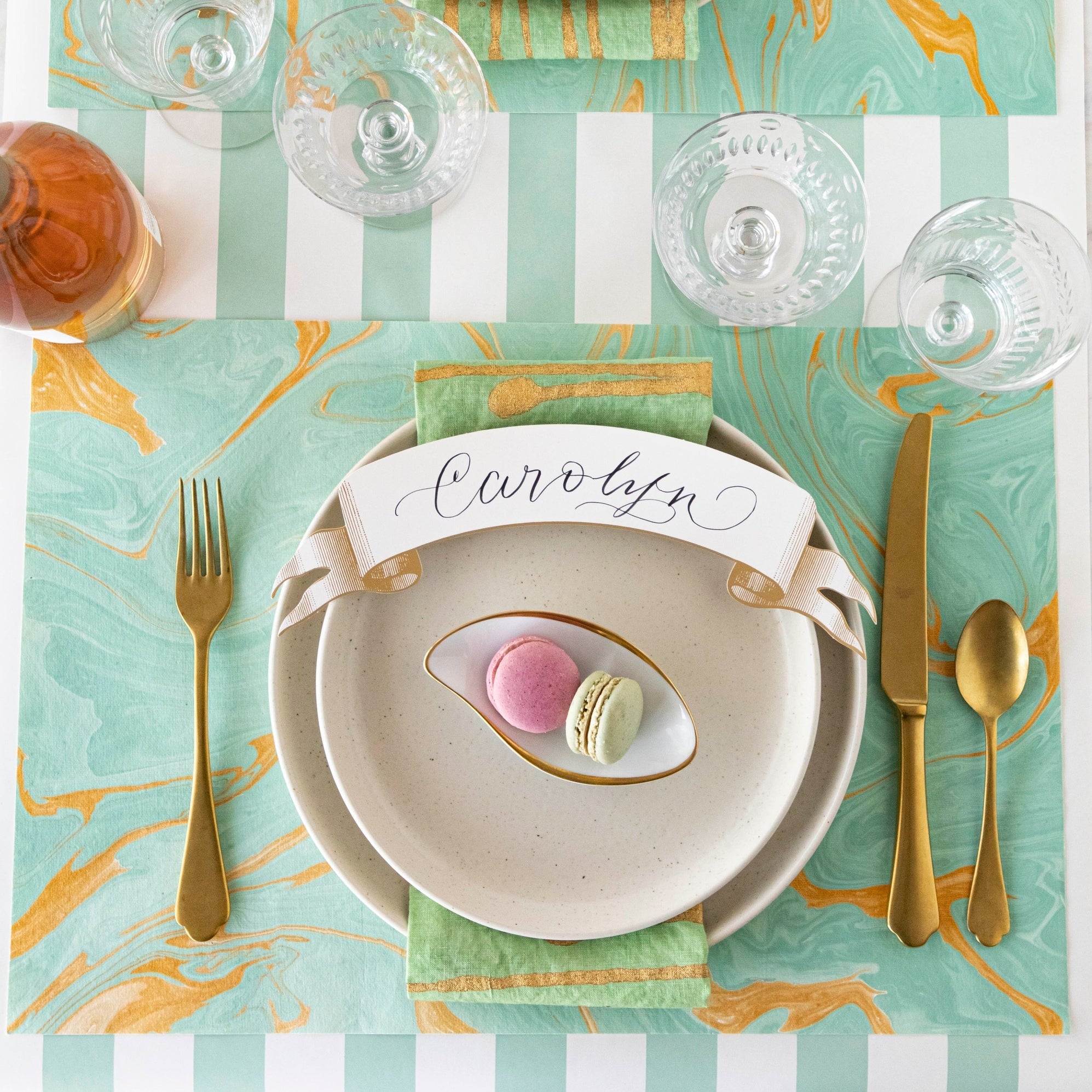 The Seafoam & Gold Vein Marbled Placemat under an elegant table setting, from above.