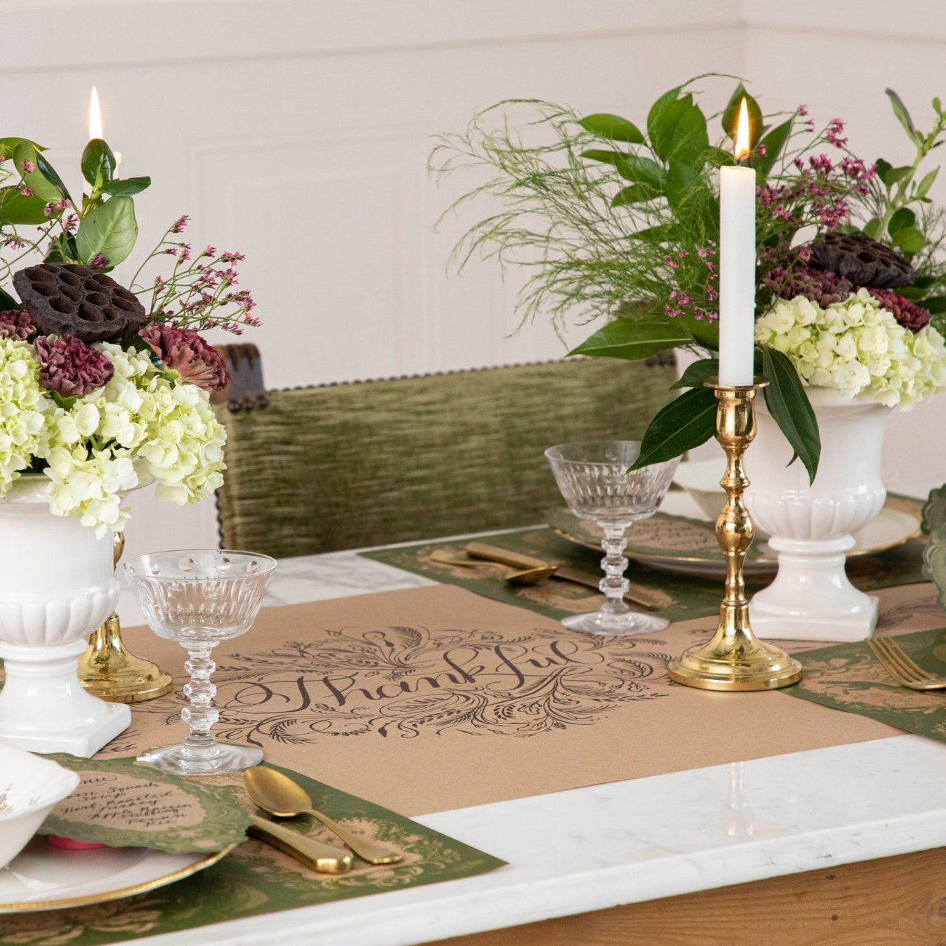 Thankful Runner under an elegant fall table setting with vases of flowers, lit candles in gold candle holders, Moss Fable Toile Placemats, vintage dinnerware and coupe glasses.