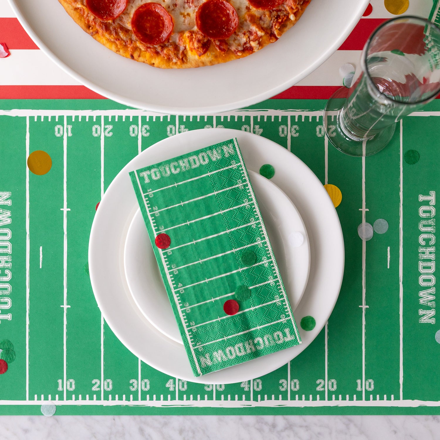 Touchdown Placemat on a sports themed place setting with the Guest Touchdown Napkin resting on the plates.