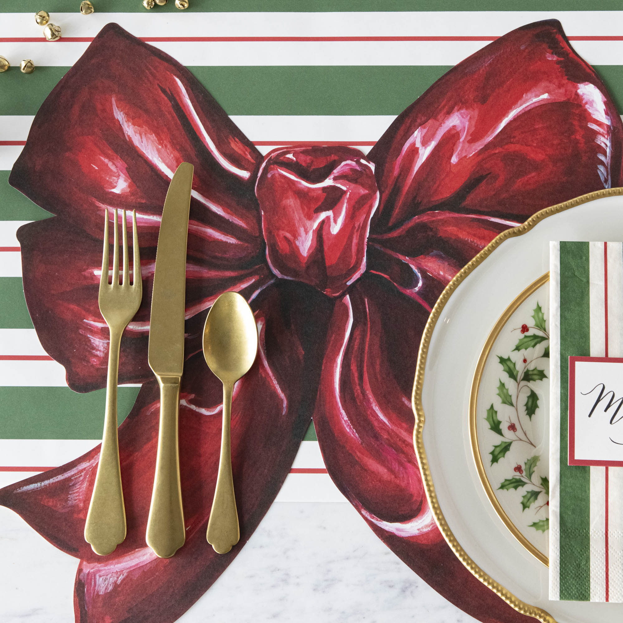 The Die-cut Bow Placemat under an elegant Christmas-themed place setting.