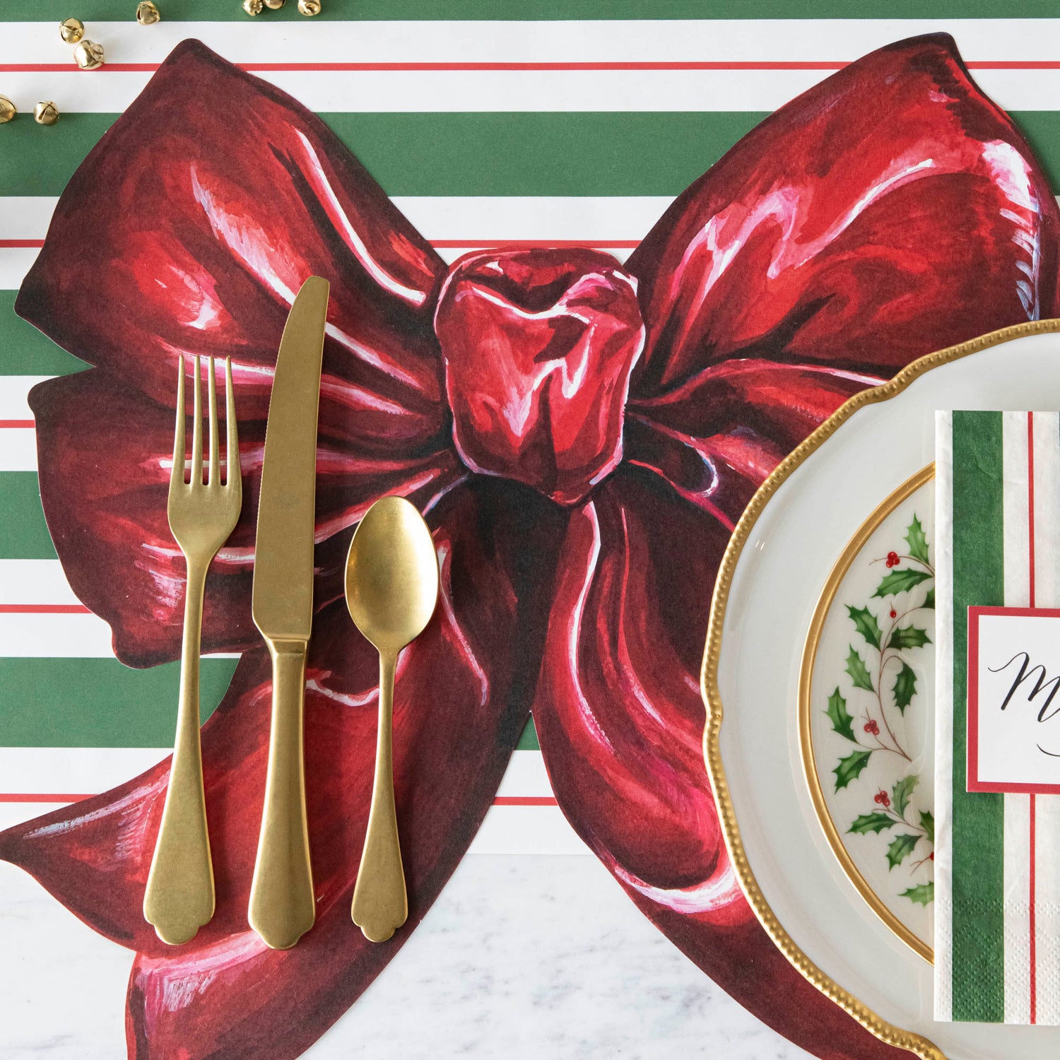 The Die-cut Bow Placemat under an elegant Christmas-themed place setting.