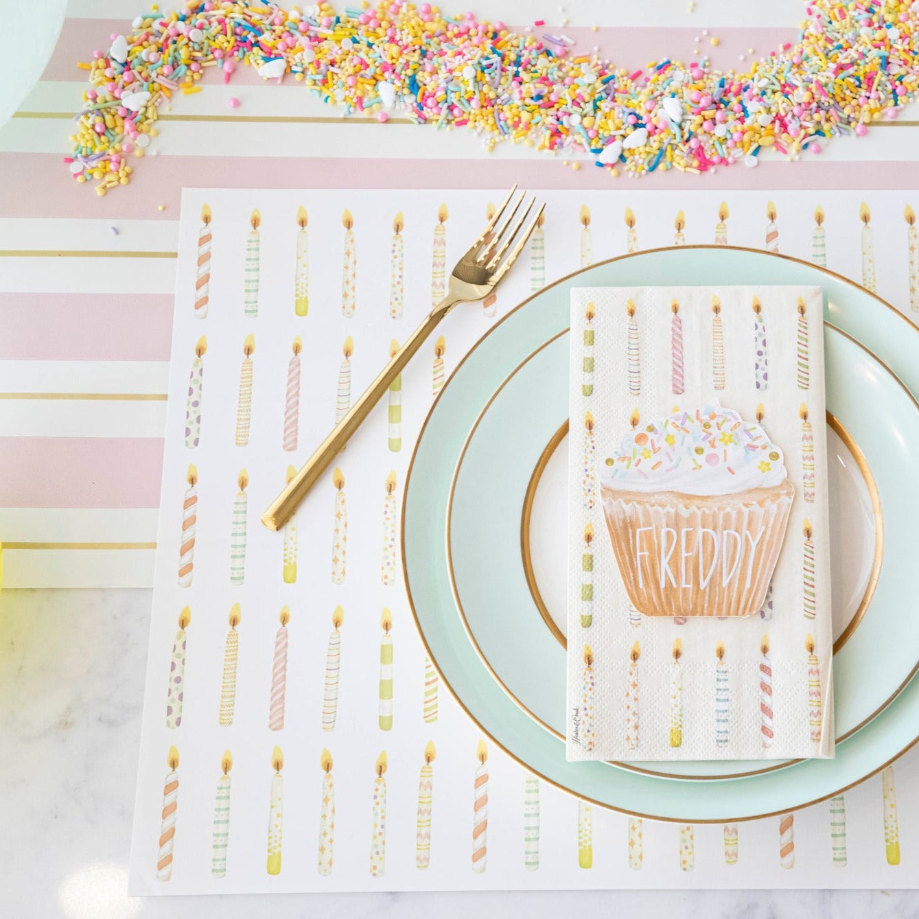 The Pink &amp; Gold Awning Stripe Runner under an elegant birthday place setting.