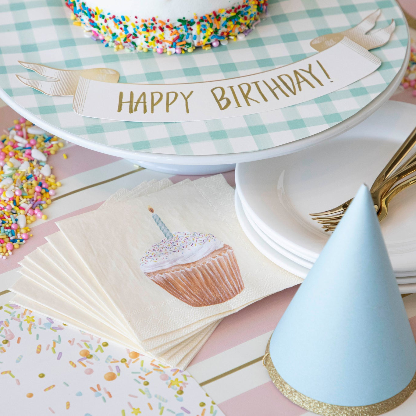 Classic Gold Banner Table Accent with "Happy Birthday!" written on it, next to cake on a birthday themed table setting