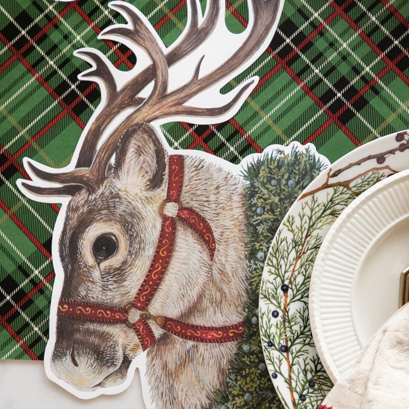 The Die-cut Reindeer Placemat under a festive Christmas place setting.