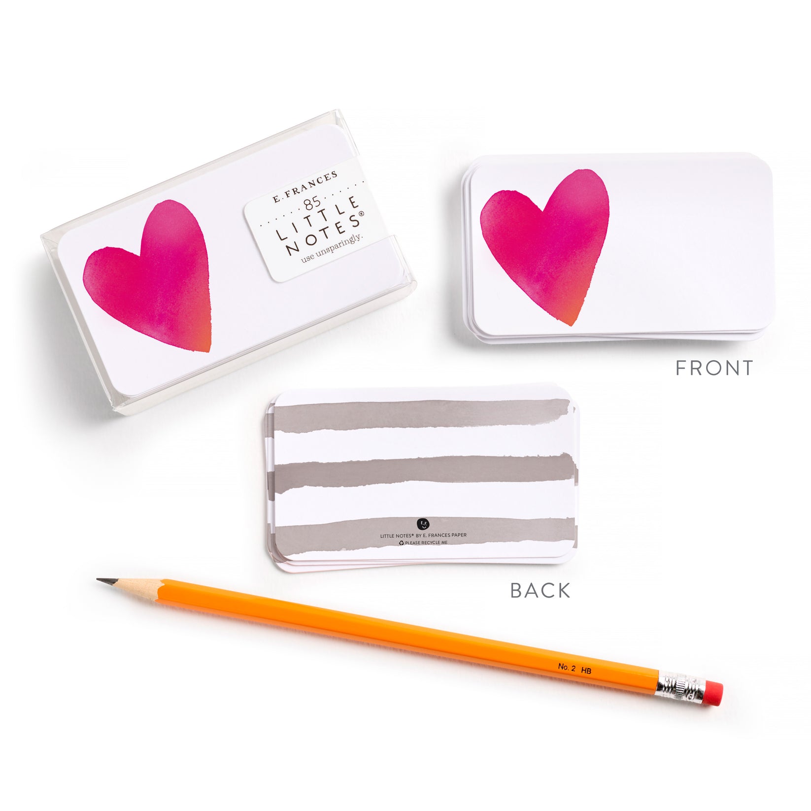 Set of heart themed little notes with a pencil on a white background.
