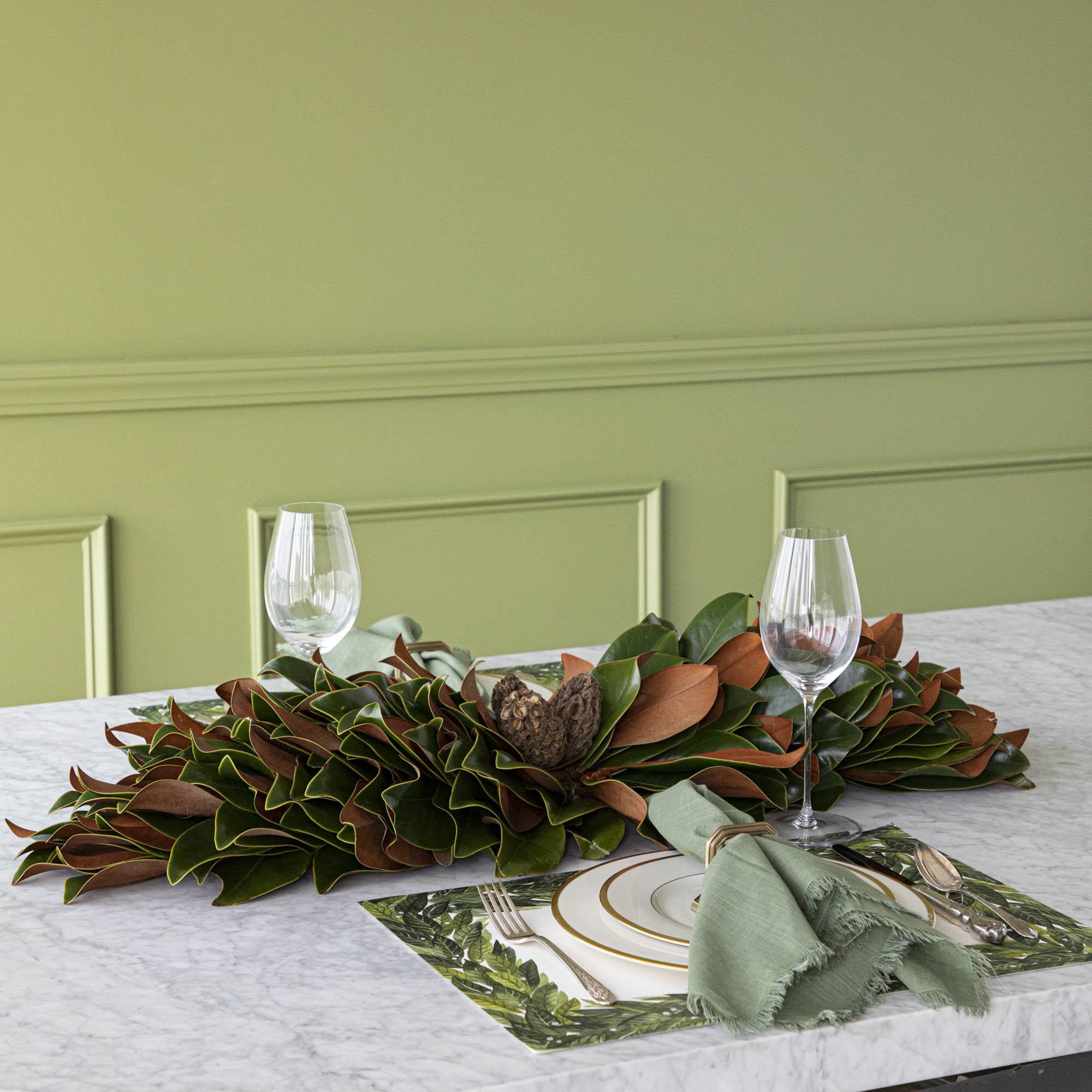Magnolia centerpiece styled on table.