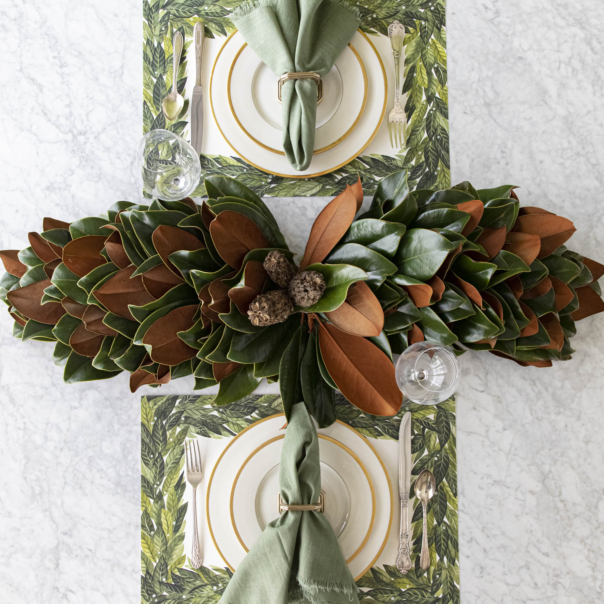Magnolia centerpiece styled on a table.