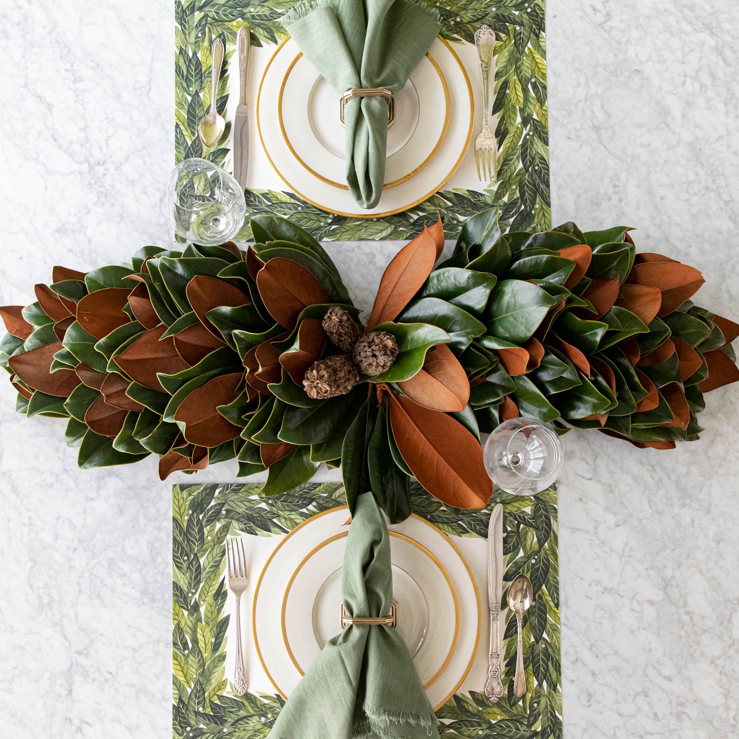 Magnolia centerpiece styled on a table.