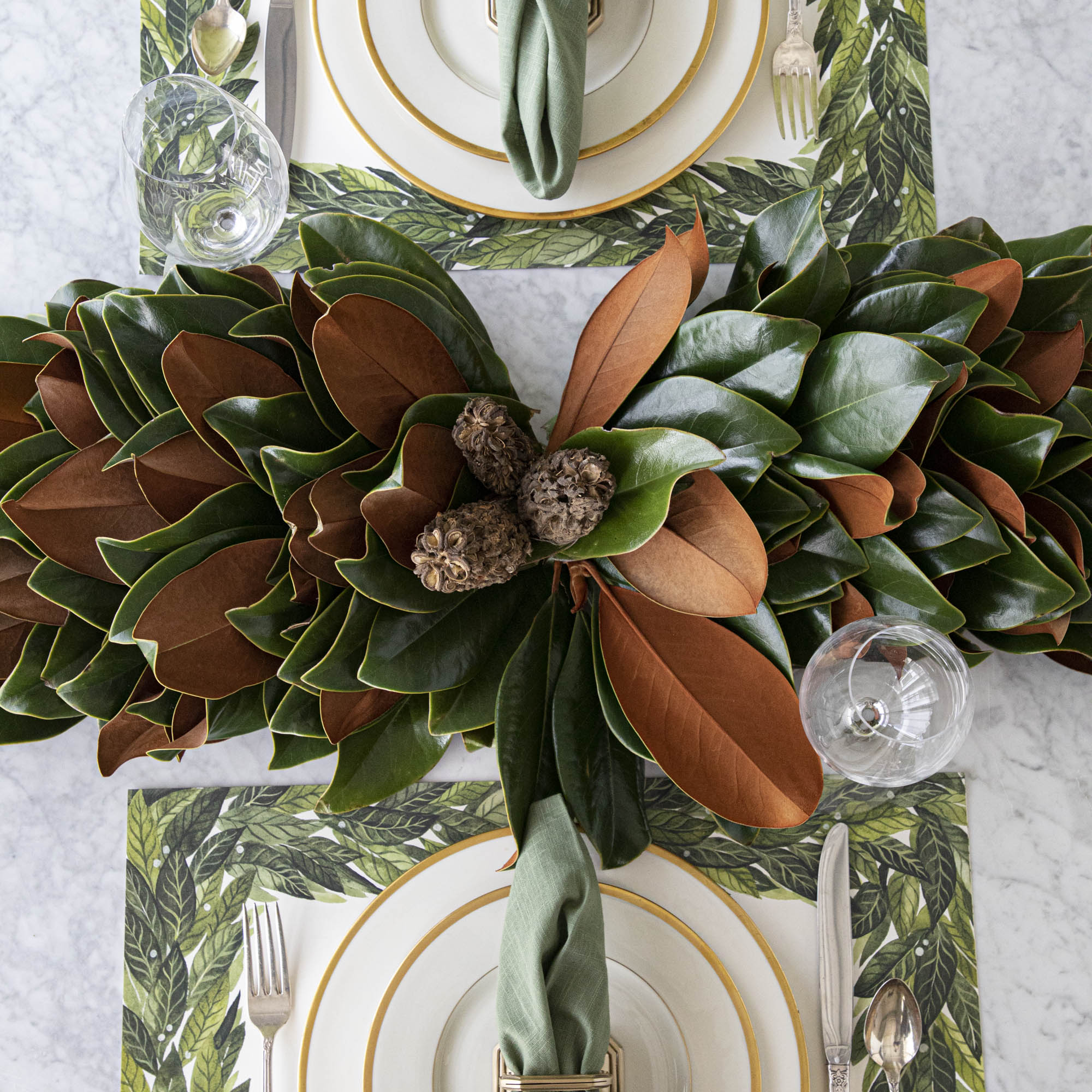 Magnolia centerpiece styled on a table.