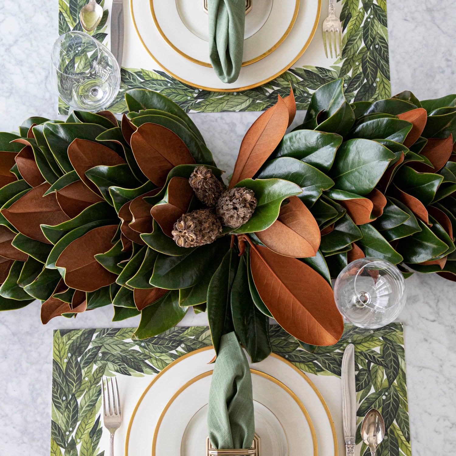Magnolia centerpiece styled on a table.