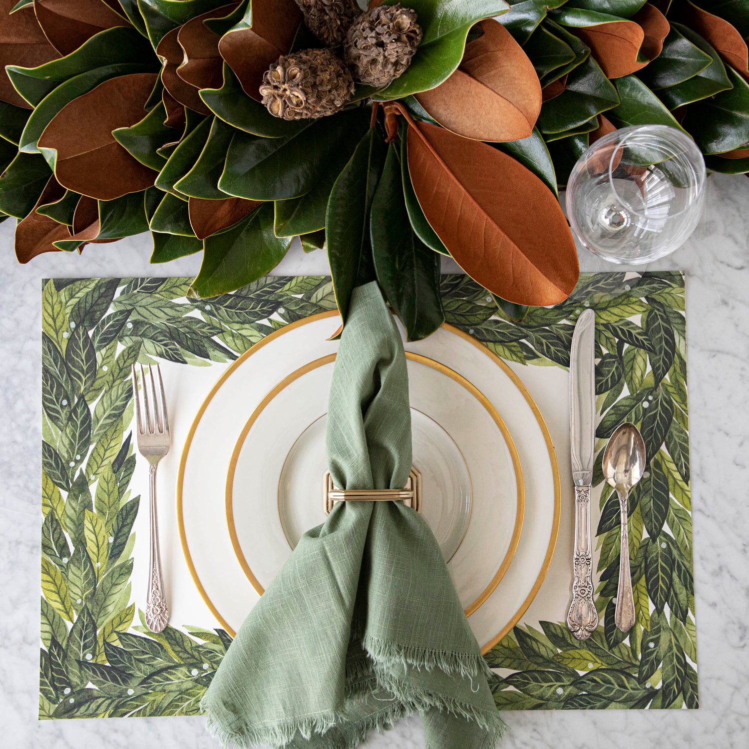 Magnolia centerpiece styled on a table.