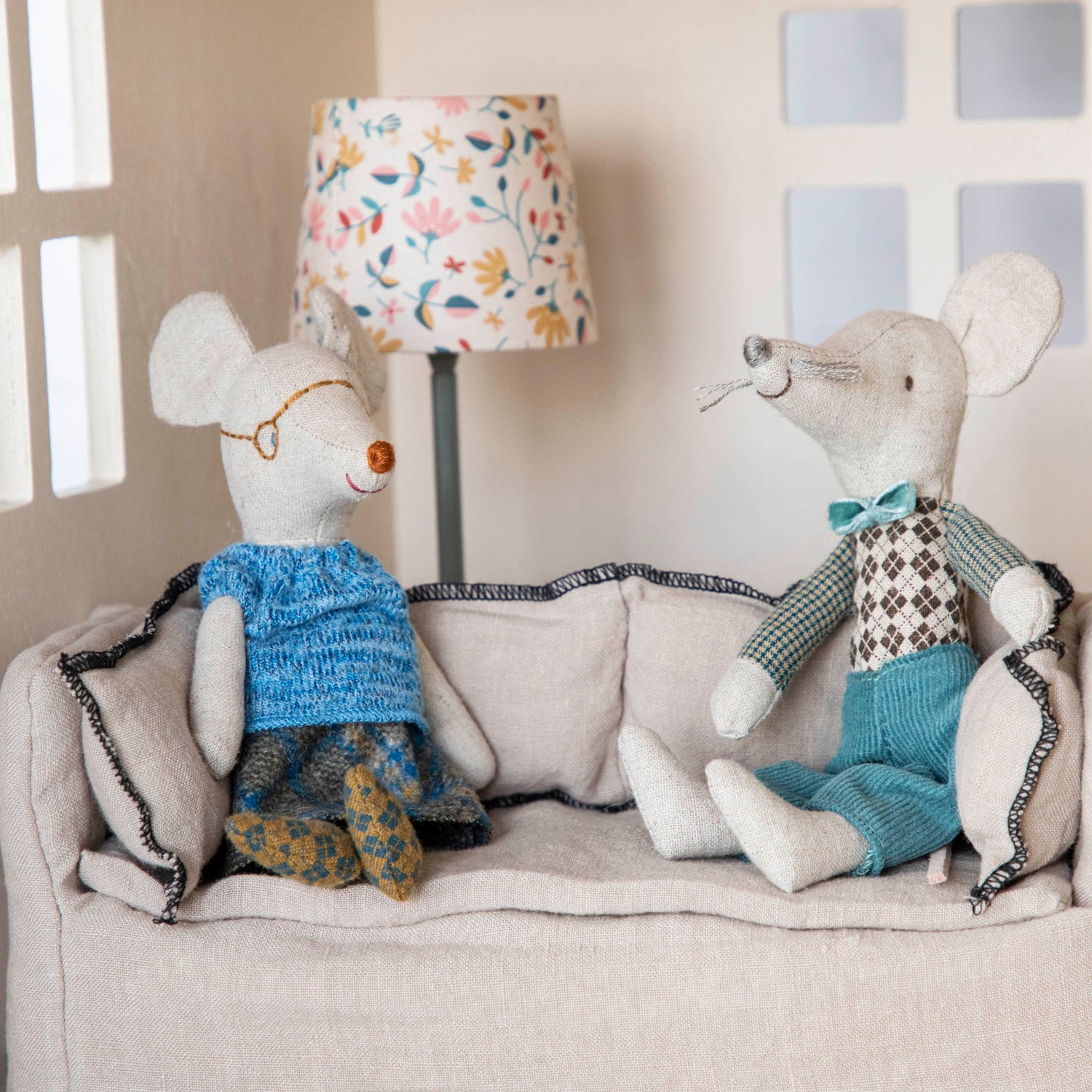 Stuffed bunny sitting in a doll stroller in a child&