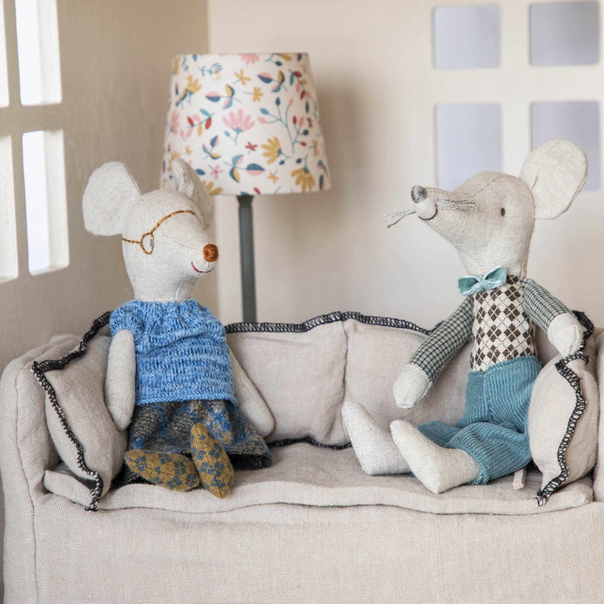 Stuffed bunny sitting in a doll stroller in a child&