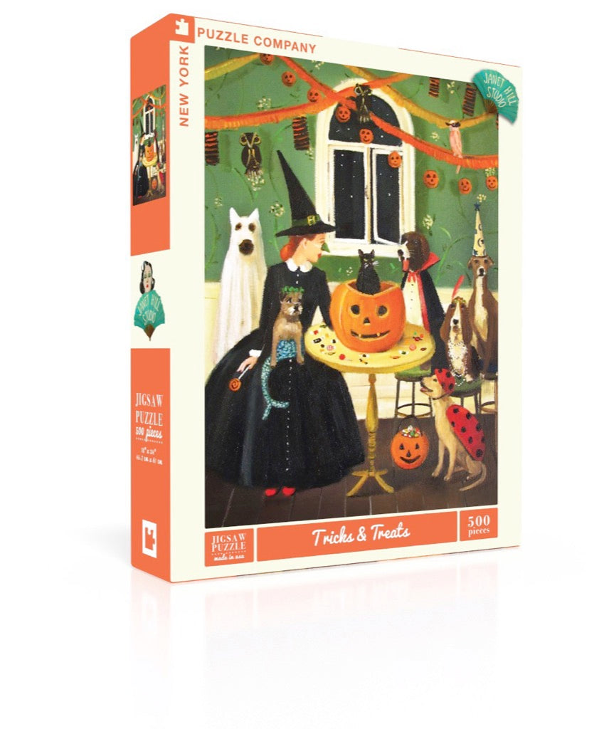 A 500 piece jigsaw puzzle depicting a whimsical Halloween scene with dogs in costumes, a black cat, and a jack-o-lantern.
