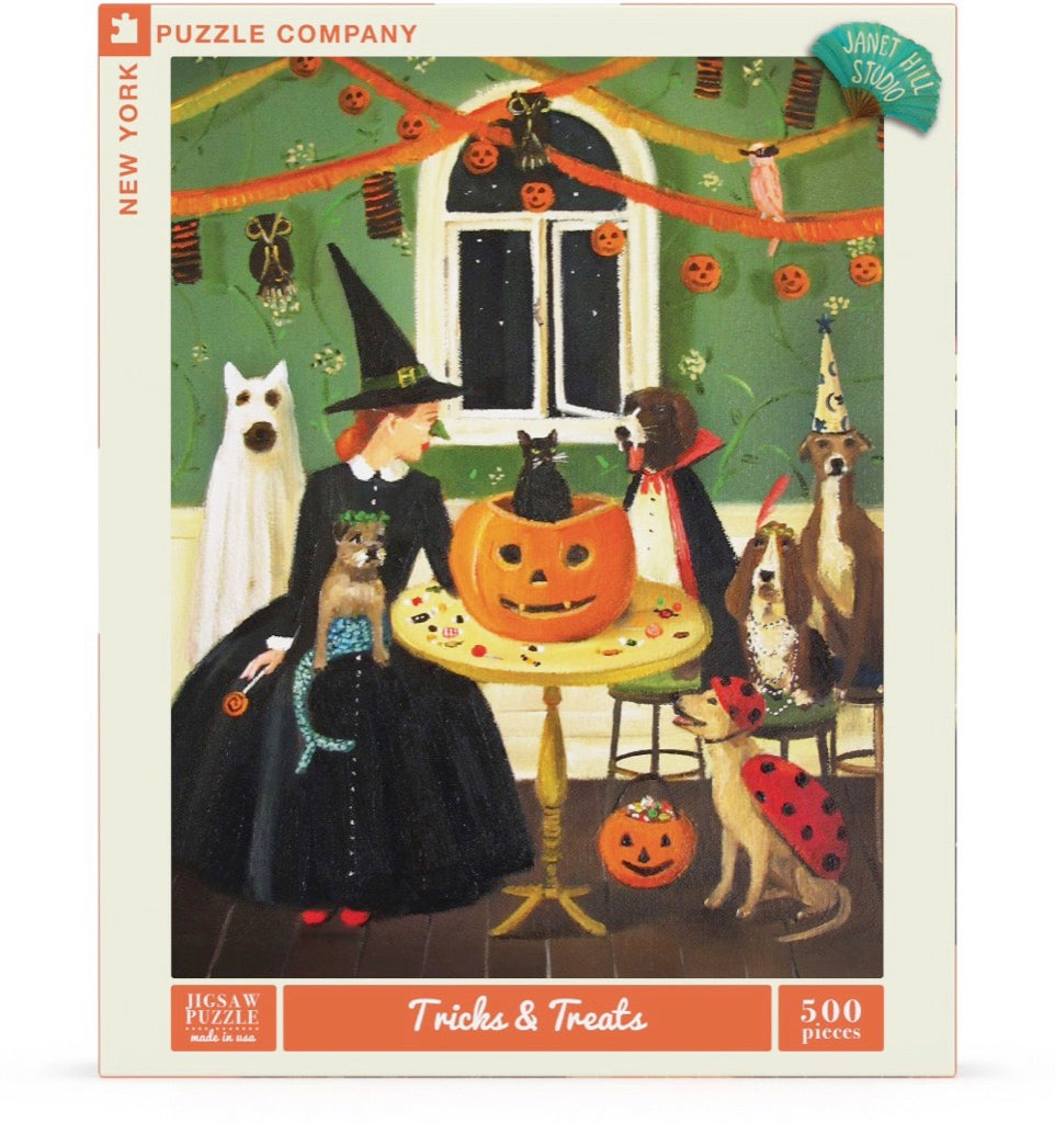 A 500 piece jigsaw puzzle depicting a whimsical Halloween scene with dogs in costumes, a black cat, and a jack-o-lantern.