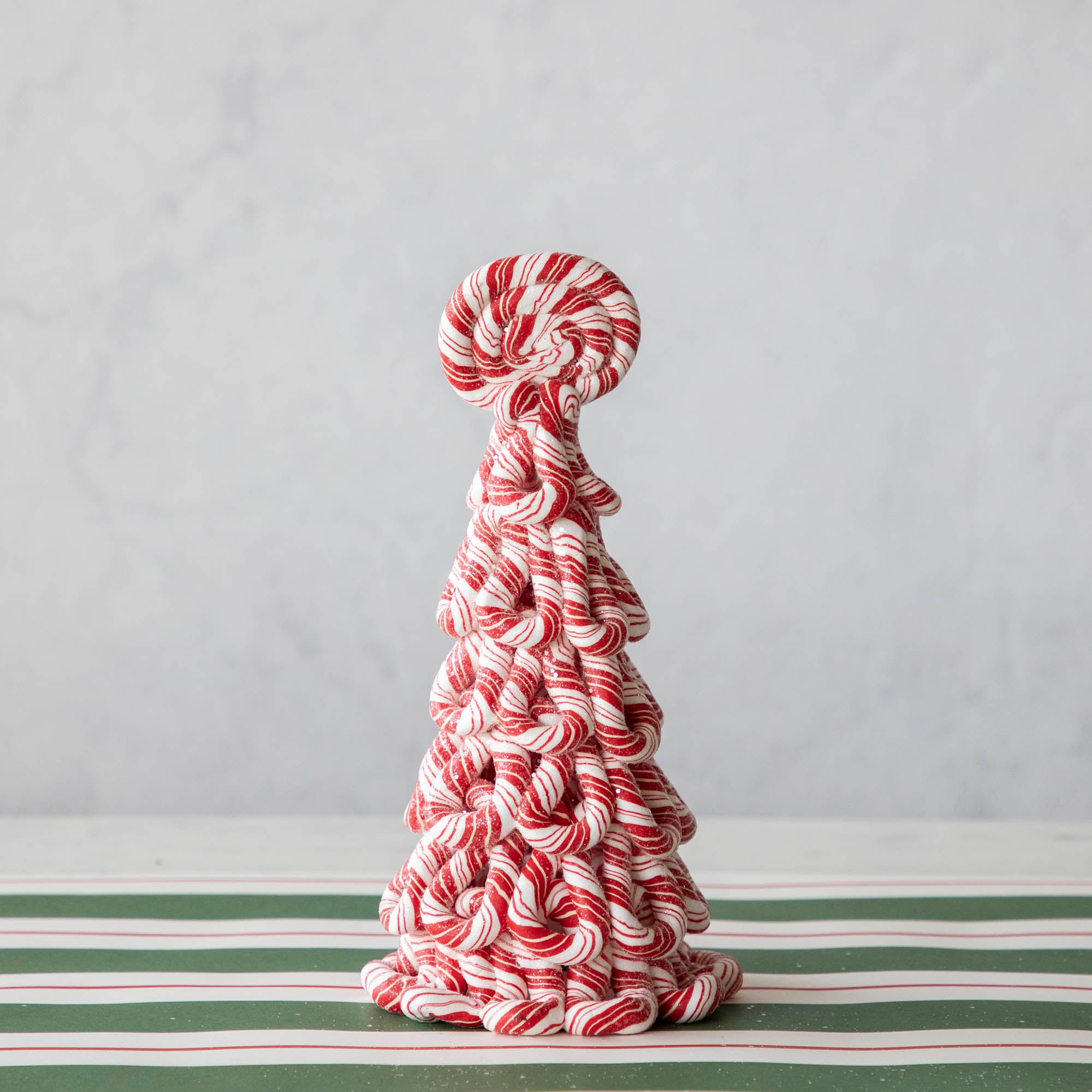The Small peppermint tree on the Green & Red Awning Stripe Runner.