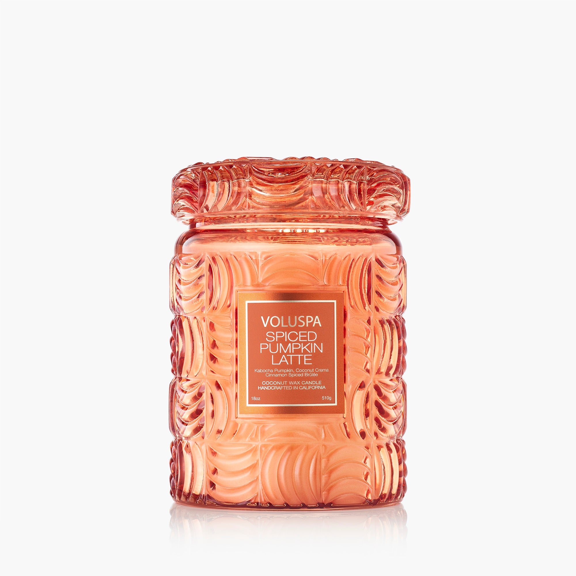 Decorative candle jar with intricate patterns and &