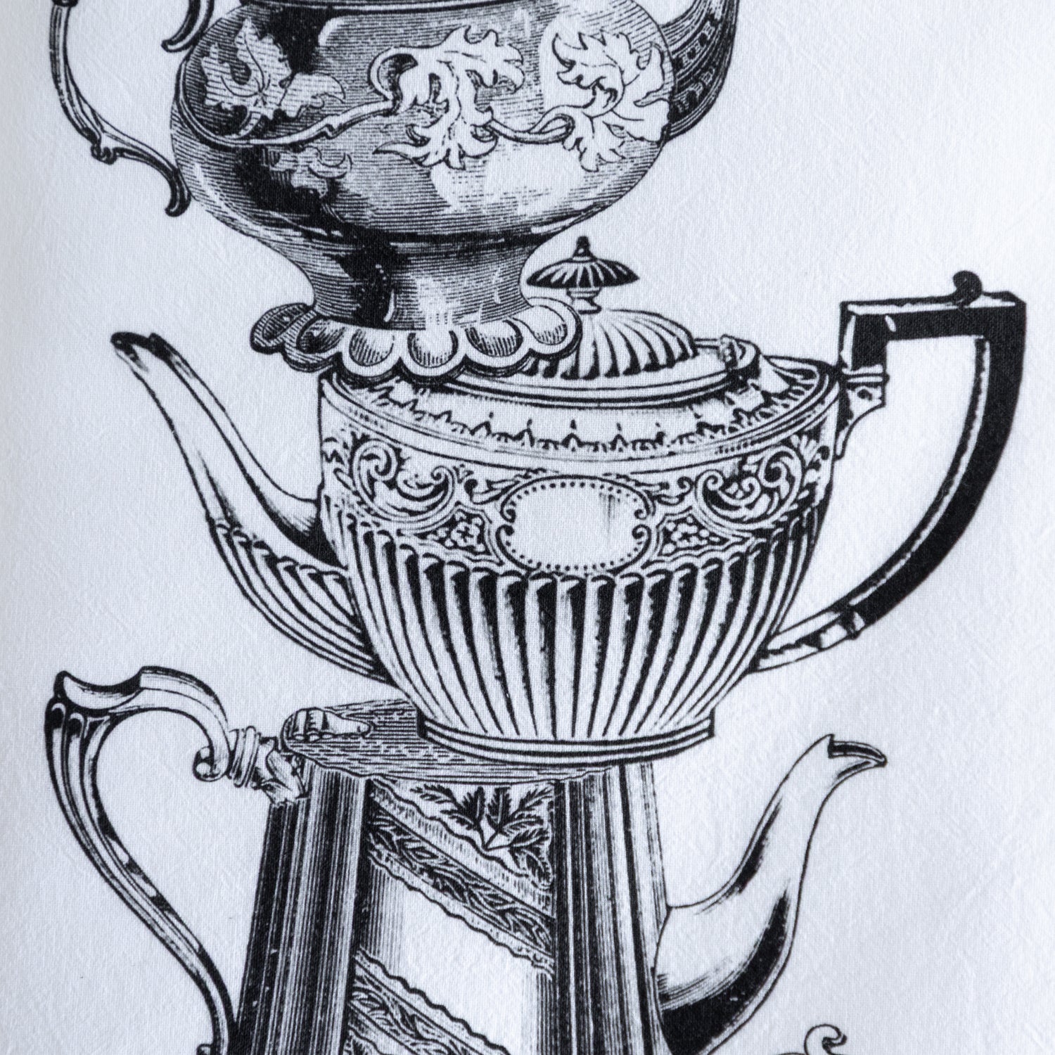 Close up of the Tea Pot Cotton Tea Towel showing vintage tea pots with intricate details in black, on a white background.