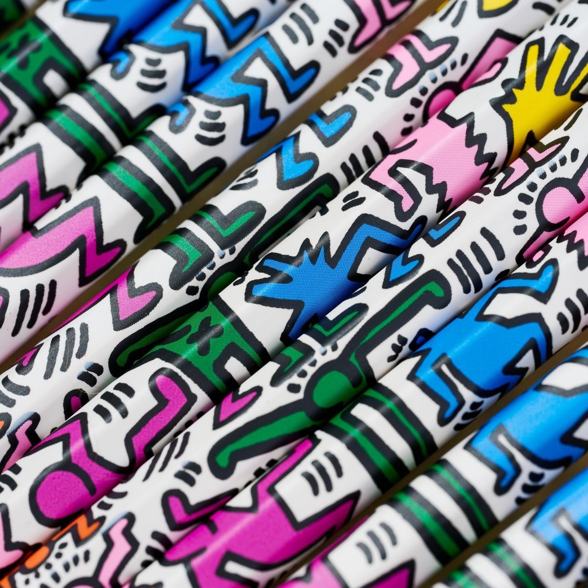 Group of Blackwing pencils with Keith Haring artwork printed on them.
