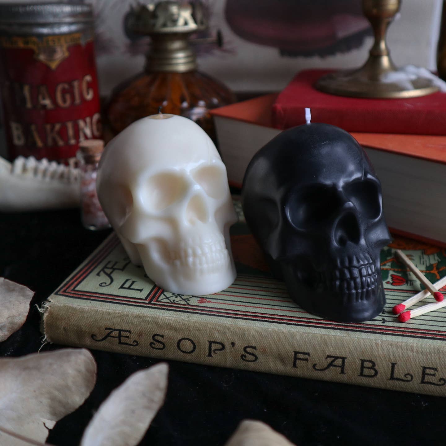 Black and cream skull shaped candles. 