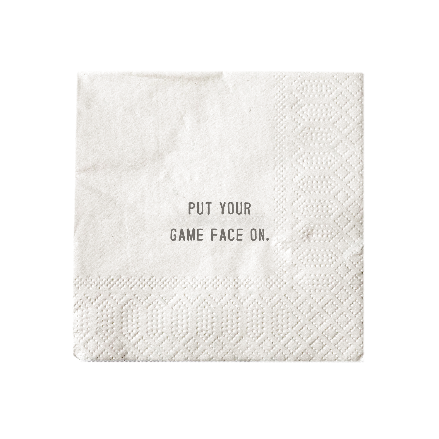 White cocktail napkin printed with &quot;Put your game face on.&quot;