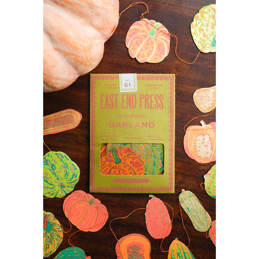 Squashes packaging surrounded by the squashes garland.