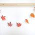 Autumn Leaves sewn garland hanging off a pole. 