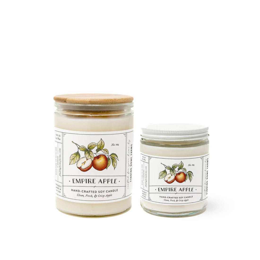 Two Empire Apple candles with labels on a white background