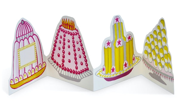 Greeting card with shaped colorful cakes on it that folds accordion style. 