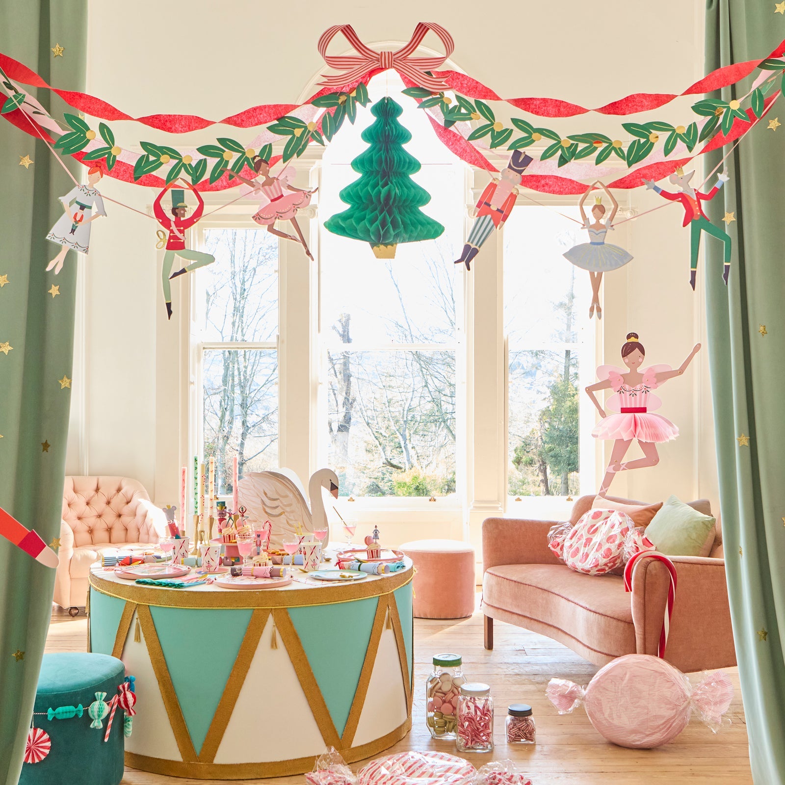 Decorated living room with Christmas-themed decorations, including a garland and tree-shaped ornaments.