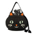 Black basket bag with cat face stitched on the front.