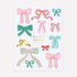 Collection of colorful bow stickers on a white background with &