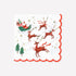 Decorative paper napkin from Meri Meri featuring an illustration of Santa and his reindeer on it. 
