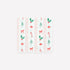 Patterned paper napkin with Christmas-themed designs on a white background. 