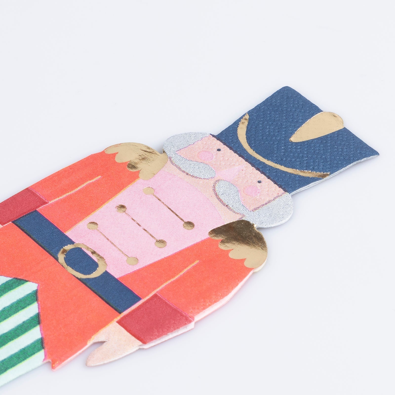 A paper napkin by Meri Meri in the shape and image of a Soldier from the Nutcracker ballet.