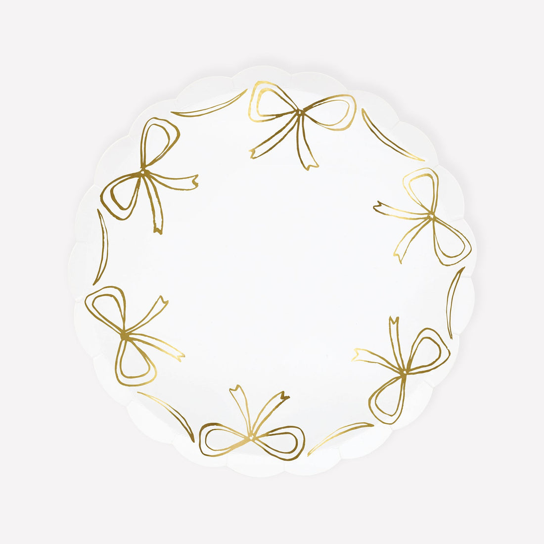 Paper plate by Meri Meri with gold bow illustrations around the edge.