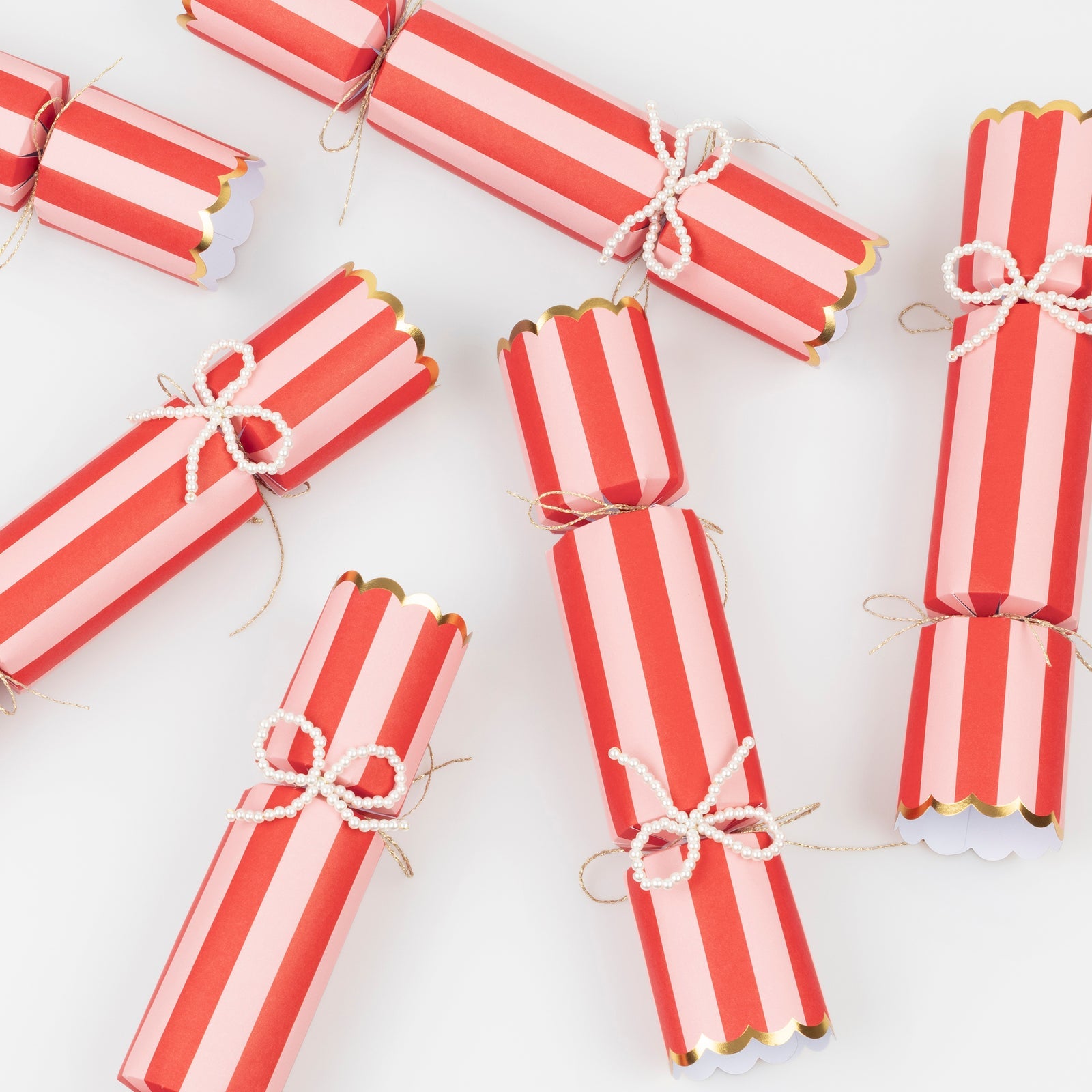 Red and white striped crackers on a white background