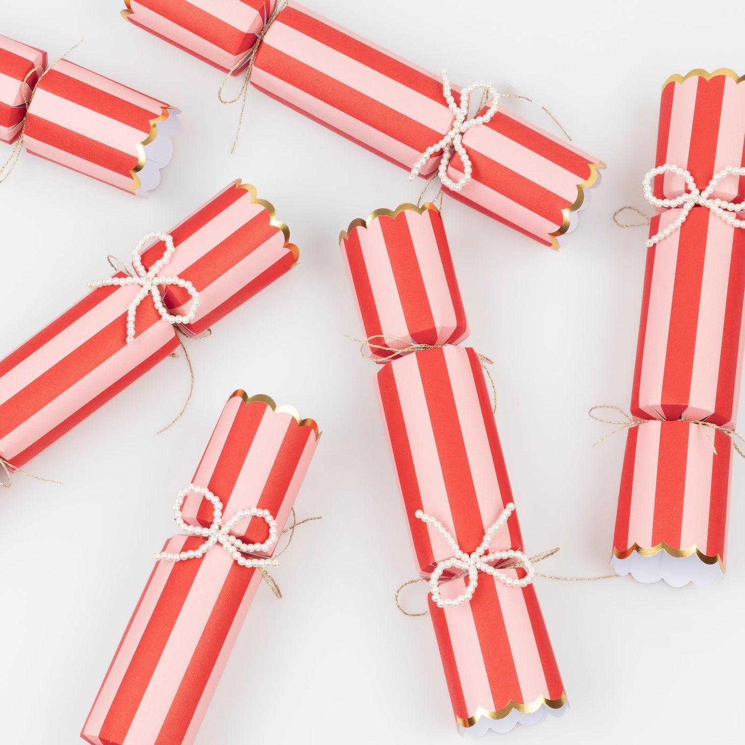 Red and white striped crackers on a white background