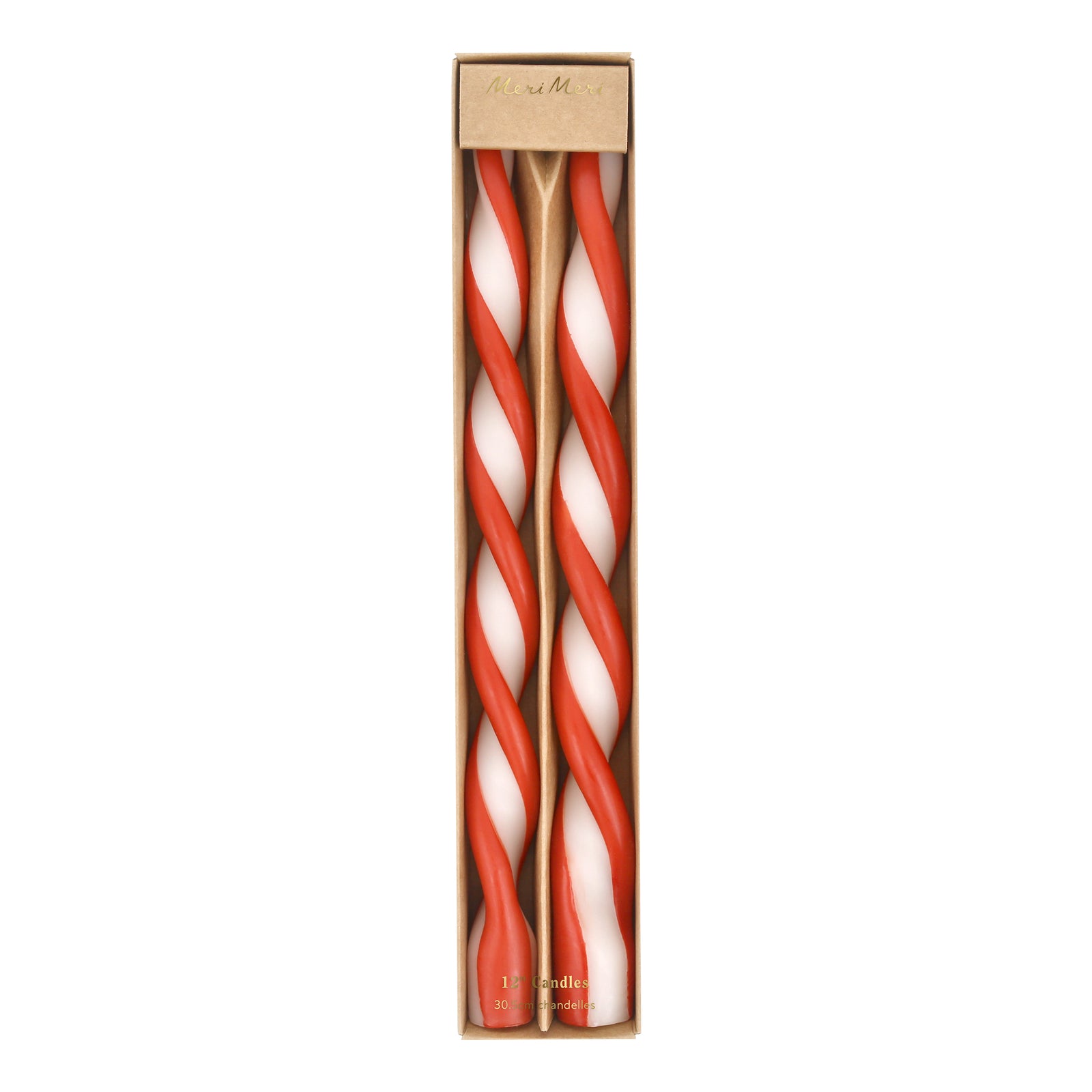 Twisted red and white candles in a cardboard box on a white background.