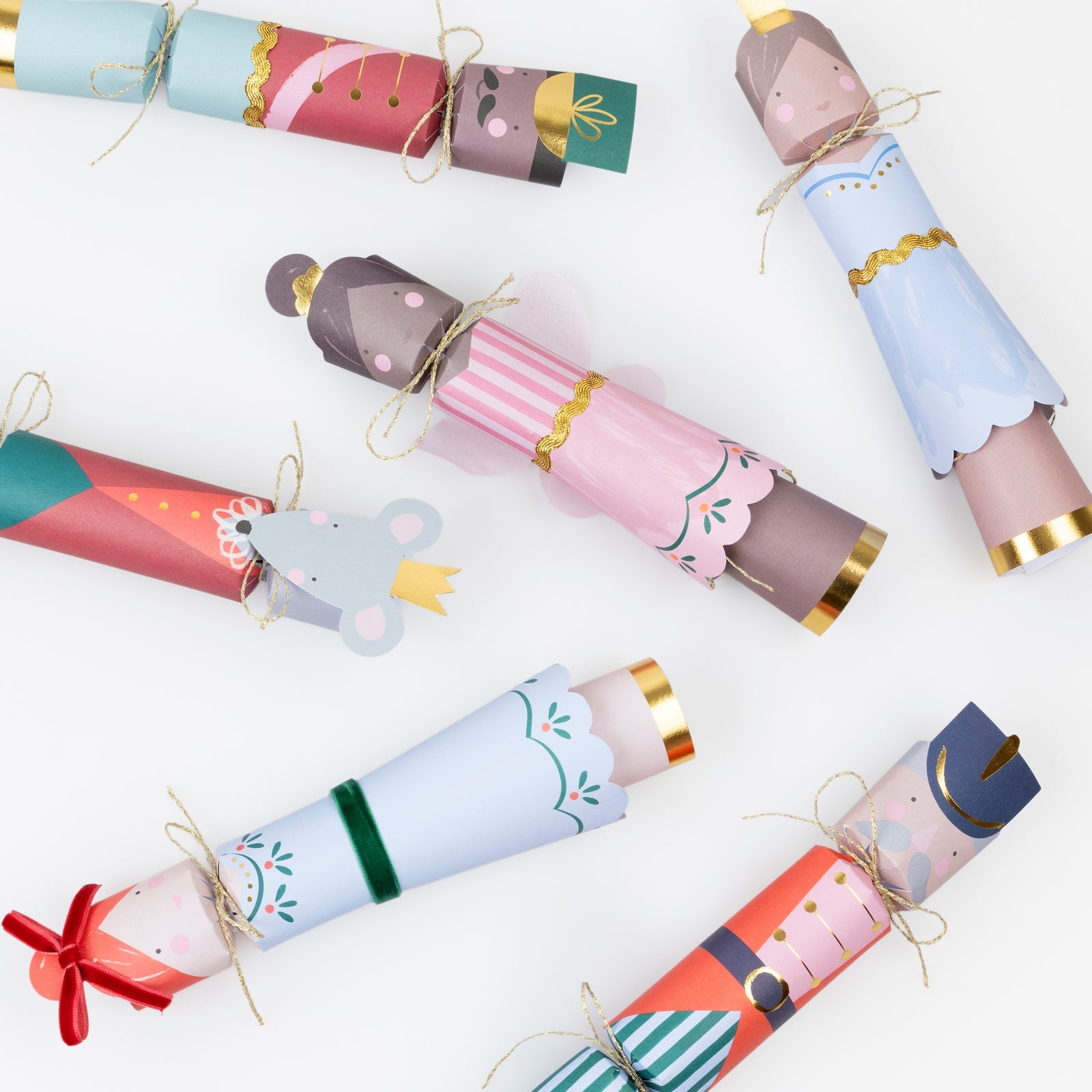 Colorful Christmas crackers with festive designs on a white background.