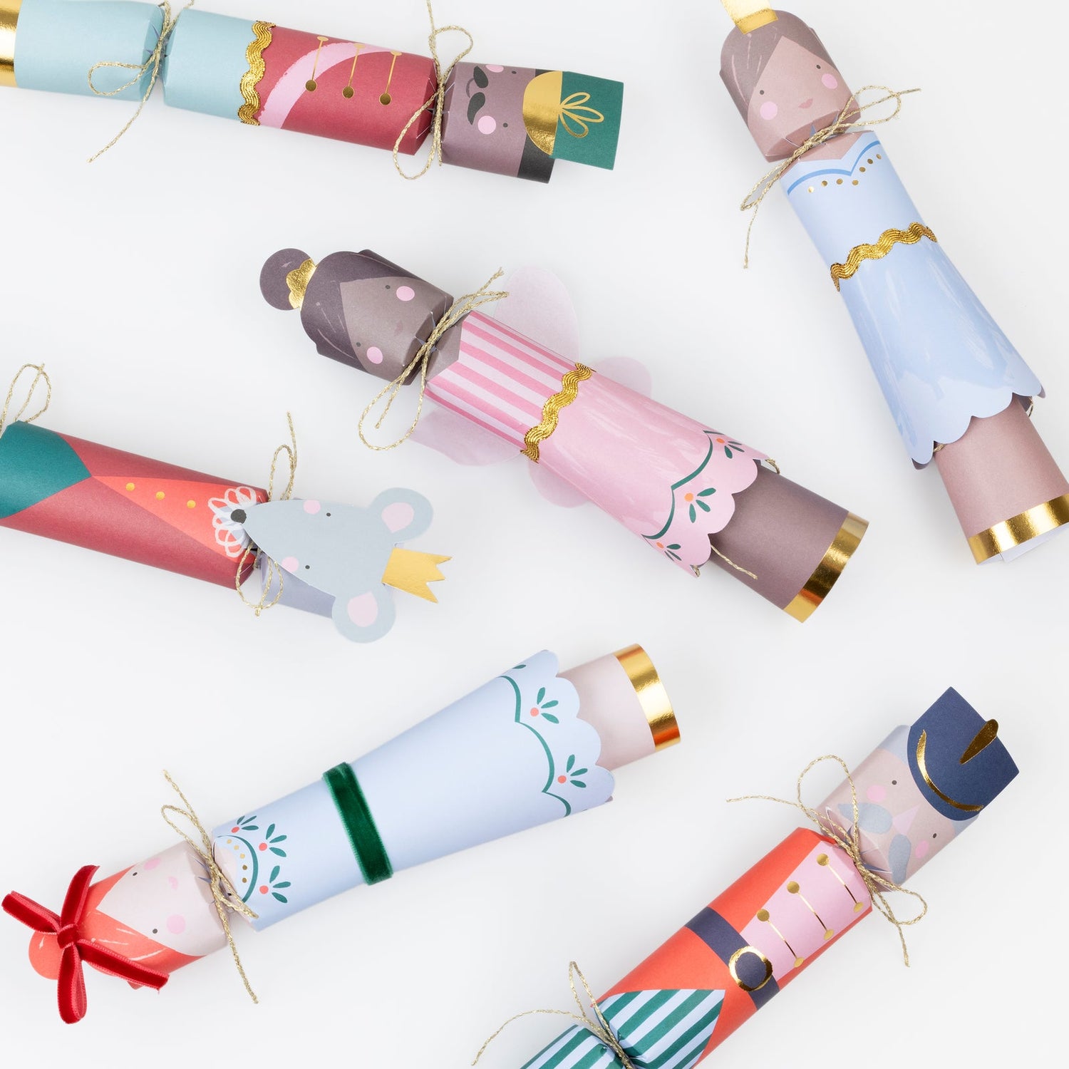 Colorful Christmas crackers with festive designs on a white background.