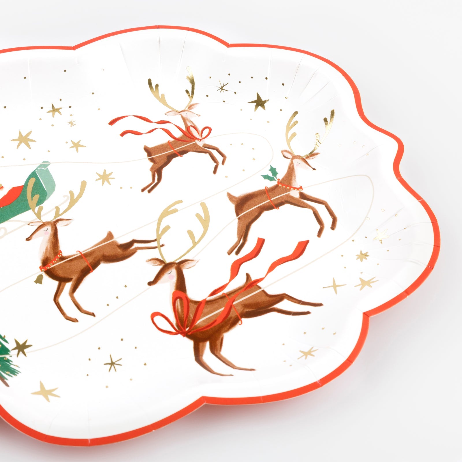 Decorative paper plate with reindeer design on a white background.