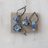 Set of blue and white ceramic pottery ornaments on a textured surface