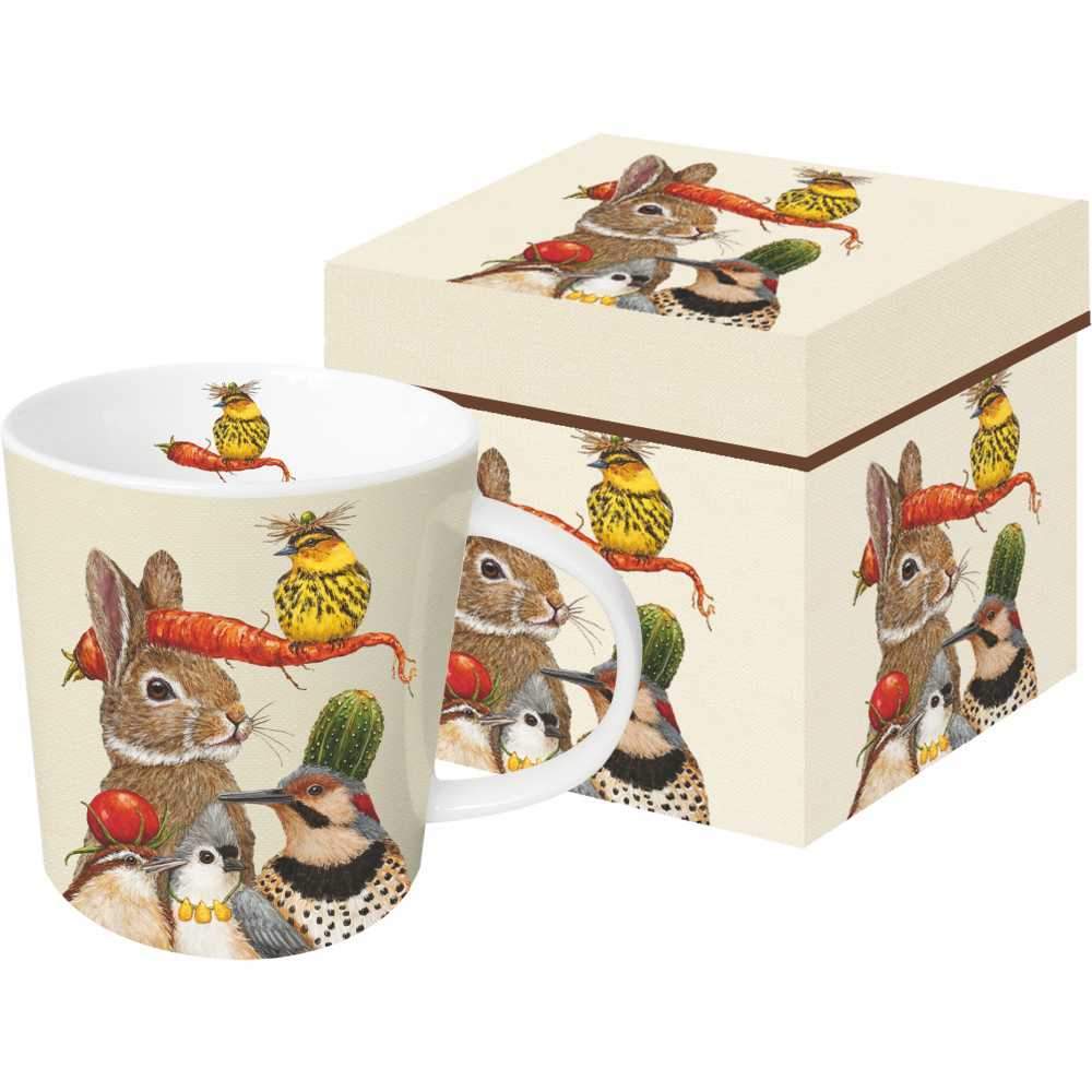 Ceramic mug featuring artwork by Vicki Sawyer with a bunny and several birds with harvest vegetables on their heads.