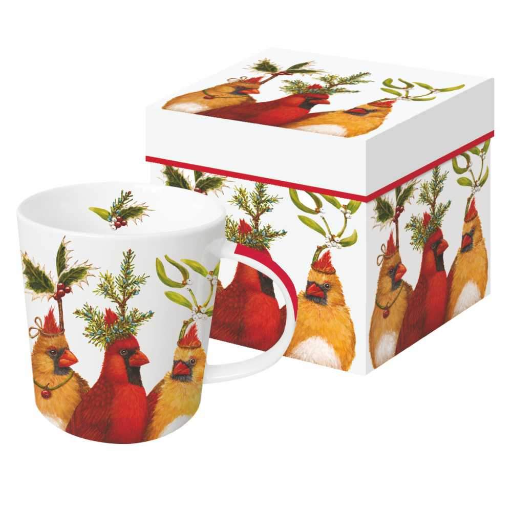 Mug featuring artwork by Vicki Sawyer depicting cardinals wearing various holiday greenery on their heads with a corresponding box in the background. 
